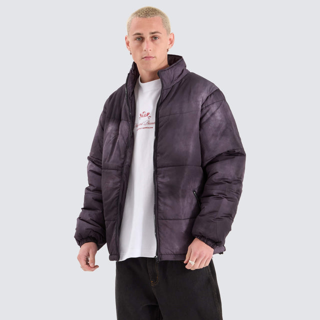 model wears Wave Dye Puffa Jacket Black Jackets Black - image 1