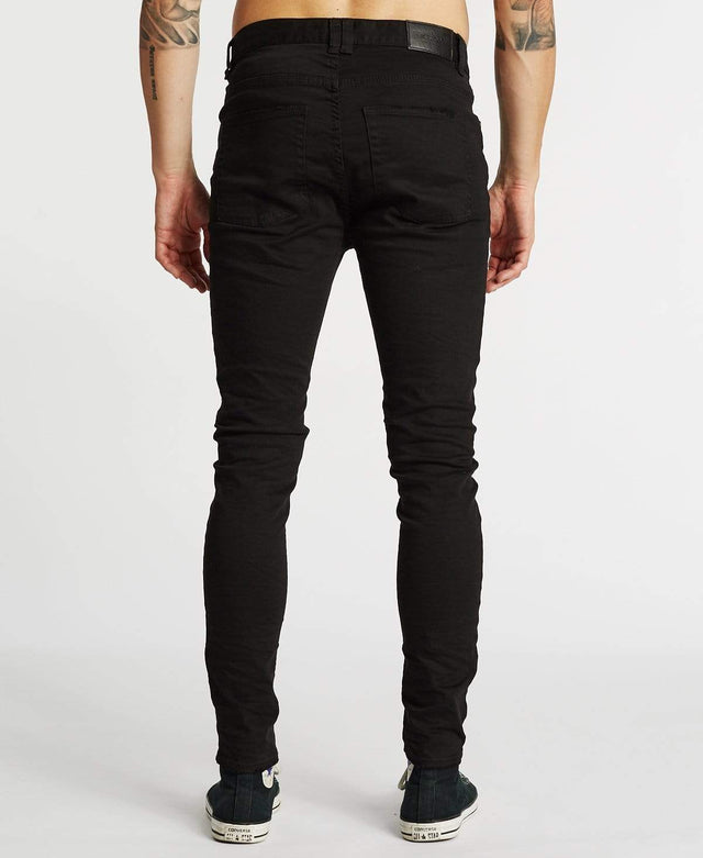 model wears K1 Super Skinny Fit Jeans Destroyed Black Pants Black - image 2