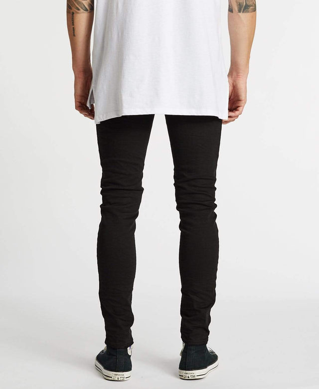model wears K1 Super Skinny Fit Jeans Destroyed Black Pants Black - image 6