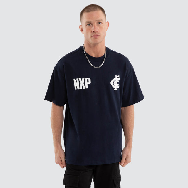Model wears Carlton Blues AFL Archive Raptor Tee Navy T-Shirts Blue – image 5