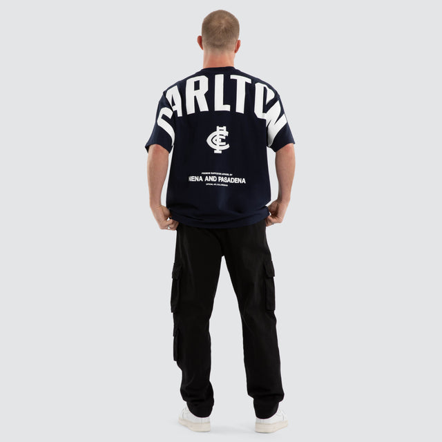 Model wears Carlton Blues AFL Archive Raptor Tee Navy T-Shirts Blue – image 4