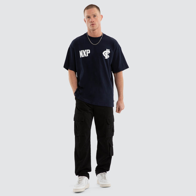 Model wears Carlton Blues AFL Archive Raptor Tee Navy T-Shirts Blue – image 2