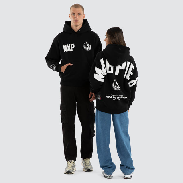 Model wears Collingwood Magpies AFL Top Tier Hoodie Jet Black Hoodies Black – image 3