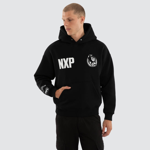 Model wears Collingwood Magpies AFL Top Tier Hoodie Jet Black Hoodies Black – image 2