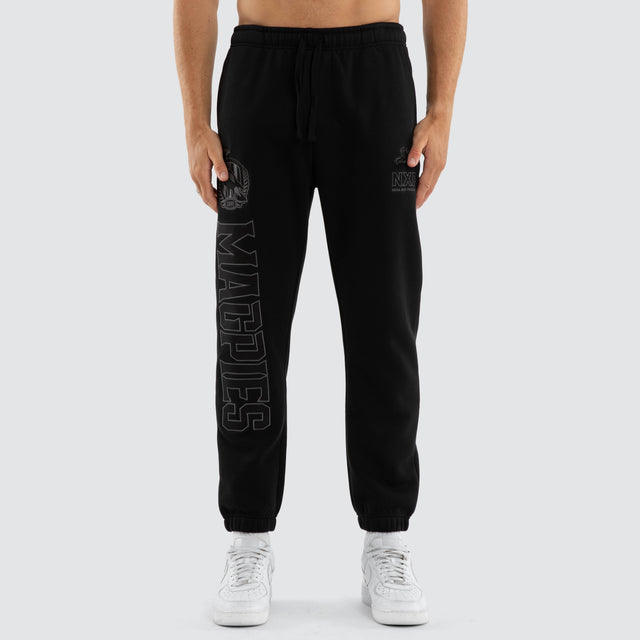 Model wears Collingwood Magpies AFL Perform Trackpant Jet Black Trackpants Black – image 3