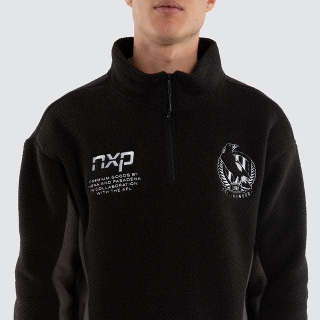 Model wears Collingwood Magpies AFL Defence Pullover Black/Charcoal Jumpers Black – image 4