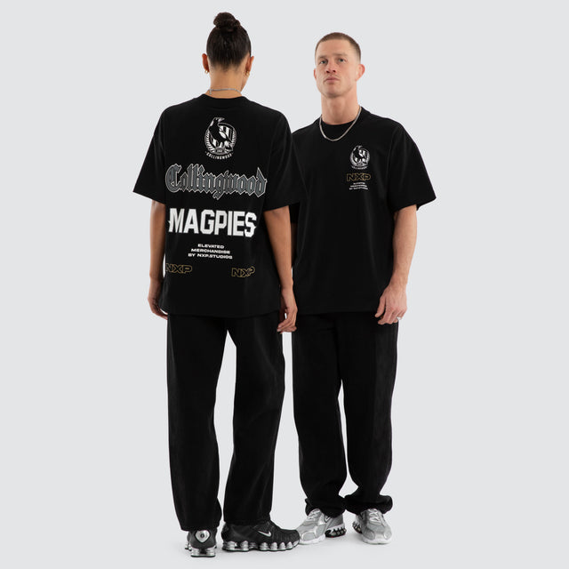 Model wears Collingwood Magpies AFL Sticker Raptor Tee Jet Black T-Shirts Black – image 2