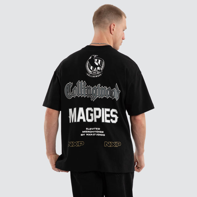Model wears Collingwood Magpies AFL Sticker Raptor Tee Jet Black T-Shirts Black – image 7