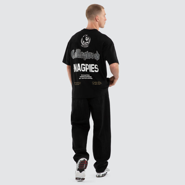 Model wears Collingwood Magpies AFL Sticker Raptor Tee Jet Black T-Shirts Black – image 4
