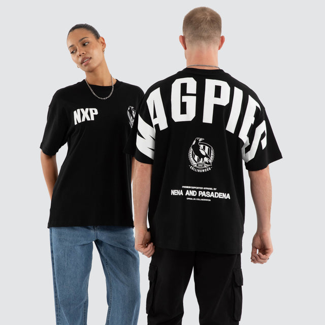 Model wears Collingwood Magpies AFL Archive Raptor Tee Jet Black T-Shirts Black – image 1
