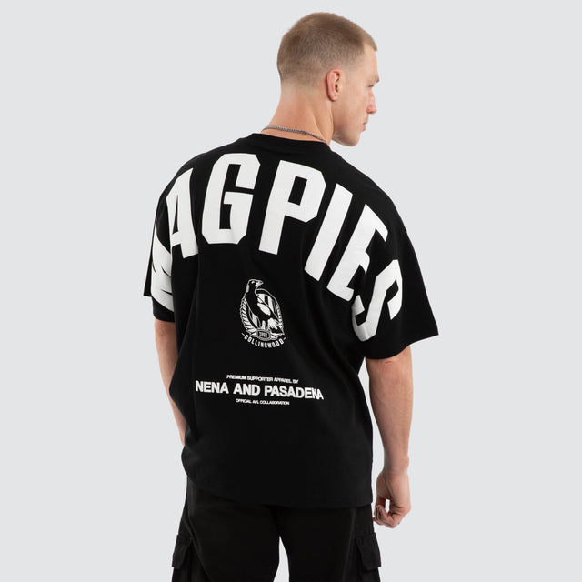 Model wears Collingwood Magpies AFL Archive Raptor Tee Jet Black T-Shirts Black – image 5