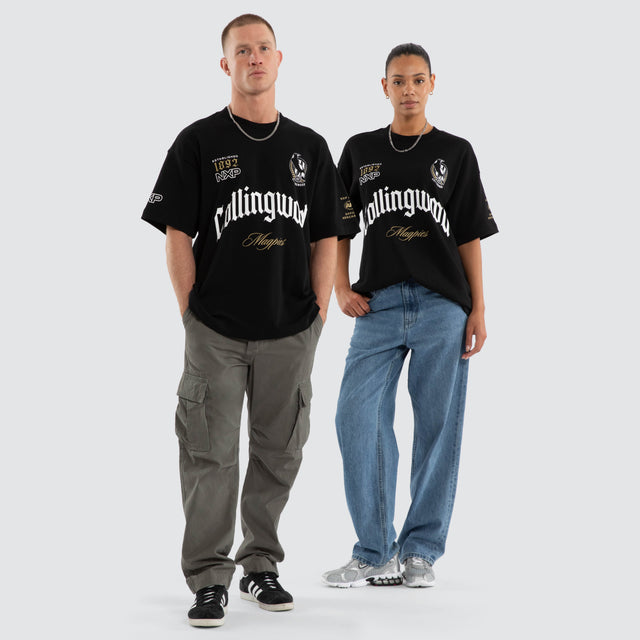 Model wears Collingwood Magpies AFL Gold Raptor Tee Jet Black T-Shirts Black – image 3