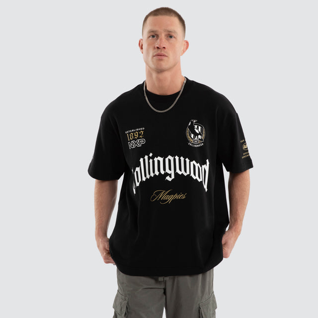 Model wears Collingwood Magpies AFL Gold Raptor Tee Jet Black T-Shirts Black – image 4