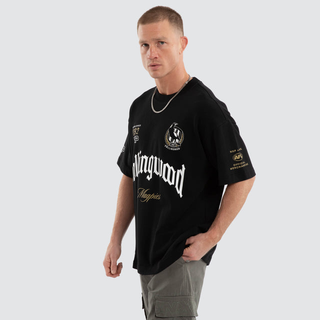 Model wears Collingwood Magpies AFL Gold Raptor Tee Jet Black T-Shirts Black – image 5