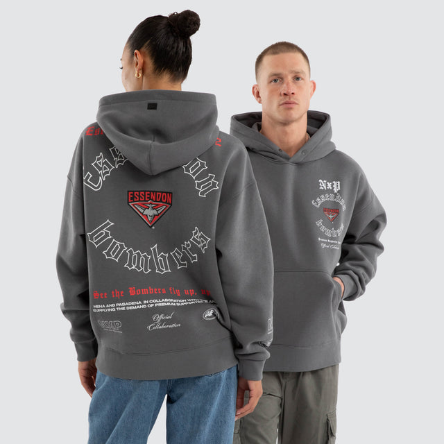 Model wears Essendon Bombers AFL Tag Box Fit Hoodie Charcoal Hoodies Grey – image 1
