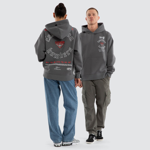Model wears Essendon Bombers AFL Tag Box Fit Hoodie Charcoal Hoodies Grey – image 3