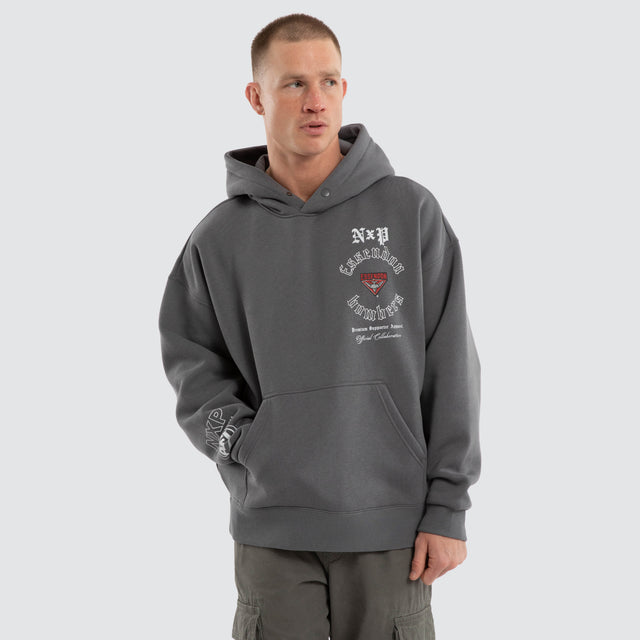Model wears Essendon Bombers AFL Tag Box Fit Hoodie Charcoal Hoodies Grey – image 7