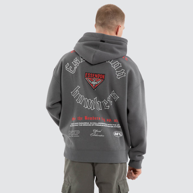 Model wears Essendon Bombers AFL Tag Box Fit Hoodie Charcoal Hoodies Grey – image 5