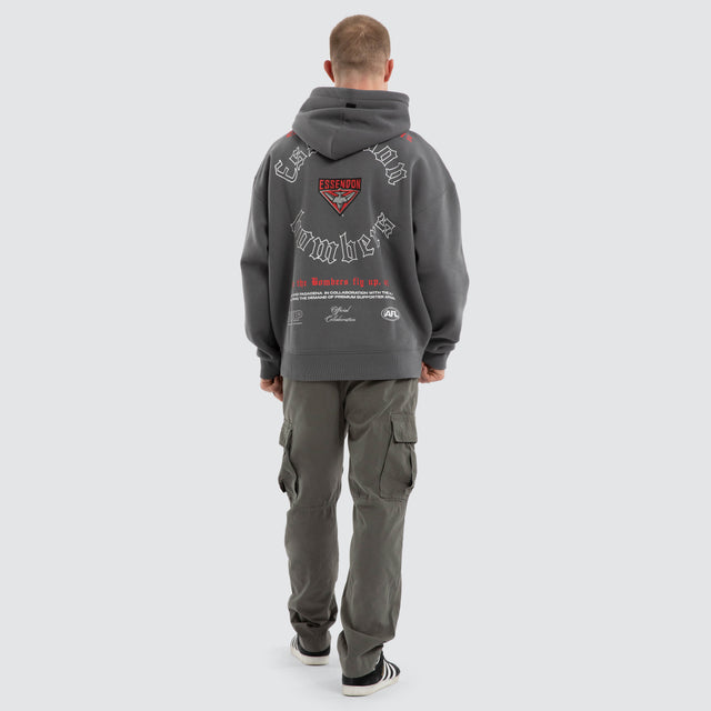 Model wears Essendon Bombers AFL Tag Box Fit Hoodie Charcoal Hoodies Grey – image 6