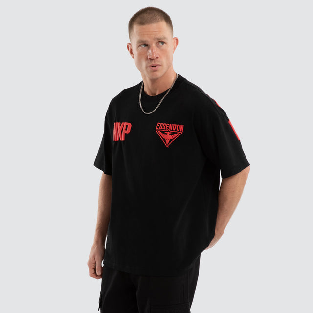 Model wears Essendon Bombers AFL Archive Raptor Tee Jet Black T-Shirts Black – image 5
