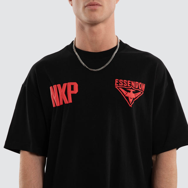 Model wears Essendon Bombers AFL Archive Raptor Tee Jet Black T-Shirts Black – image 6