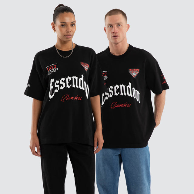 Model wears Essendon Bombers AFL Gold Raptor Tee Jet Black T-Shirts Black – image 1