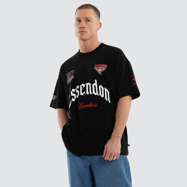 Model wears Essendon Bombers AFL Gold Raptor Tee Jet Black T-Shirts Black – image 6