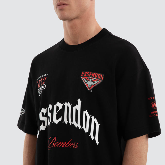 Model wears Essendon Bombers AFL Gold Raptor Tee Jet Black T-Shirts Black – image 7