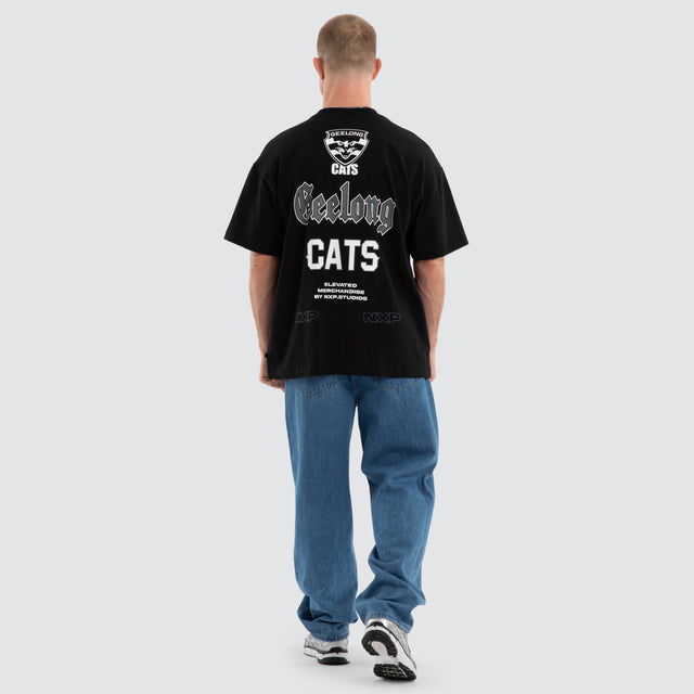Model wears Geelong Cats AFL Sticker Raptor Tee Jet Black T-Shirts Black – image 7