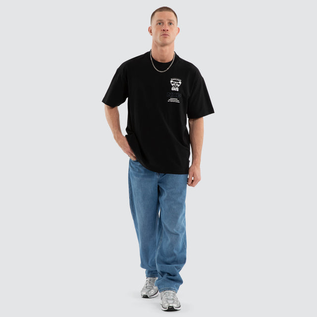 Model wears Geelong Cats AFL Sticker Raptor Tee Jet Black T-Shirts Black – image 2