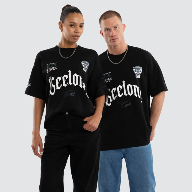 Model wears Geelong Cats AFL Gold Raptor Tee Jet Black T-Shirts Black – image 1