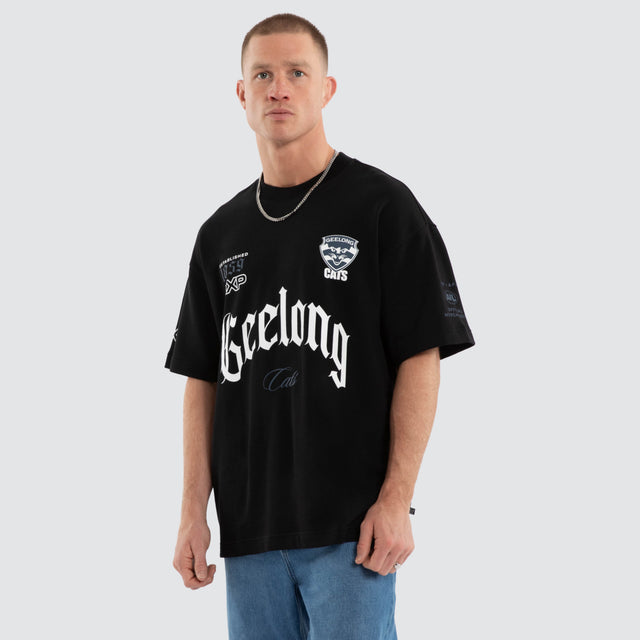 Model wears Geelong Cats AFL Gold Raptor Tee Jet Black T-Shirts Black – image 5