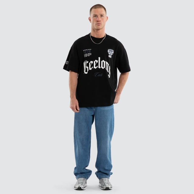 Model wears Geelong Cats AFL Gold Raptor Tee Jet Black T-Shirts Black – image 3