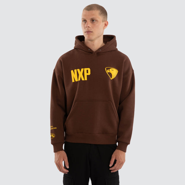 Model wears Hawthorn Hawks AFL Top Tier Hoodie Brown Hoodies Brown – image 2