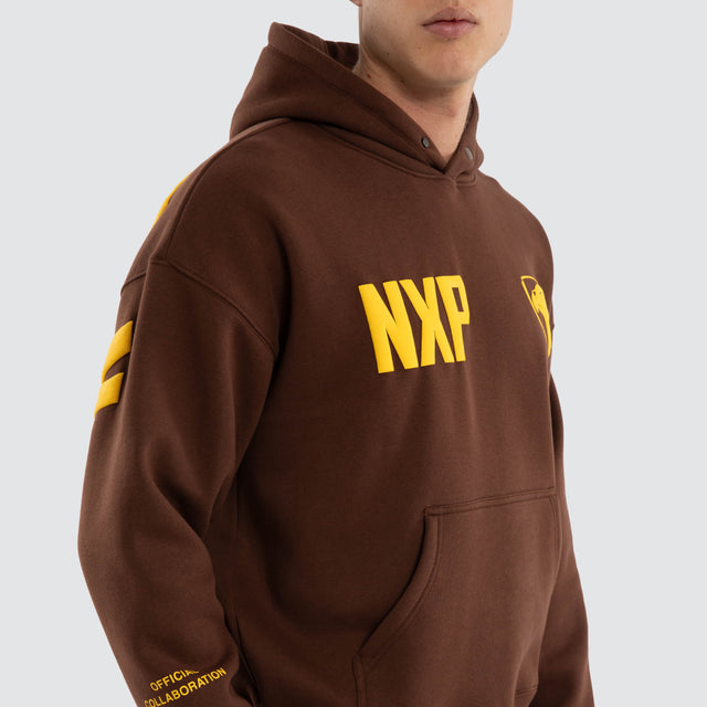 Model wears Hawthorn Hawks AFL Top Tier Hoodie Brown Hoodies Brown – image 5