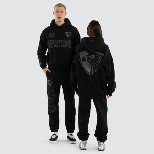 Model wears Hawthorn Hawks AFL Persistent Hoodie Jet Black Hoodies Black – image 3