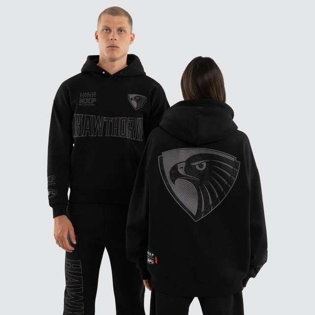 Model wears Hawthorn Hawks AFL Persistent Hoodie Jet Black Hoodies Black – image 1
