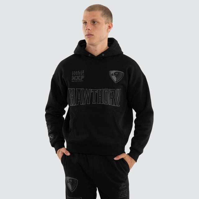 Model wears Hawthorn Hawks AFL Persistent Hoodie Jet Black Hoodies Black – image 2