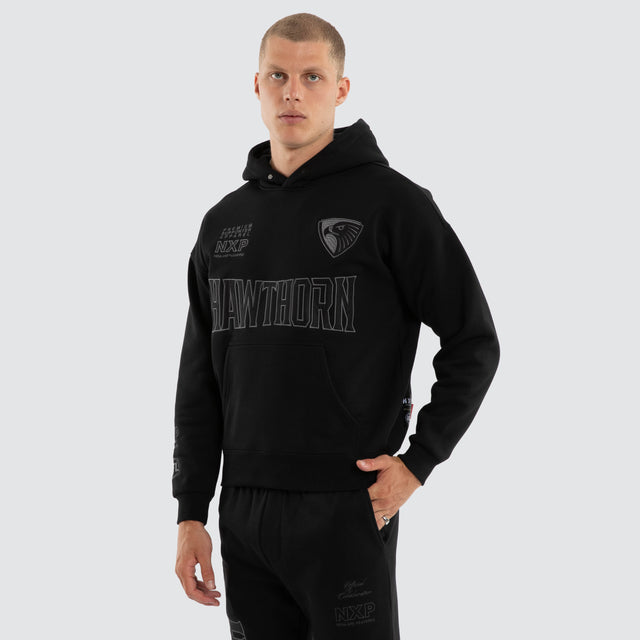 Model wears Hawthorn Hawks AFL Persistent Hoodie Jet Black Hoodies Black – image 4
