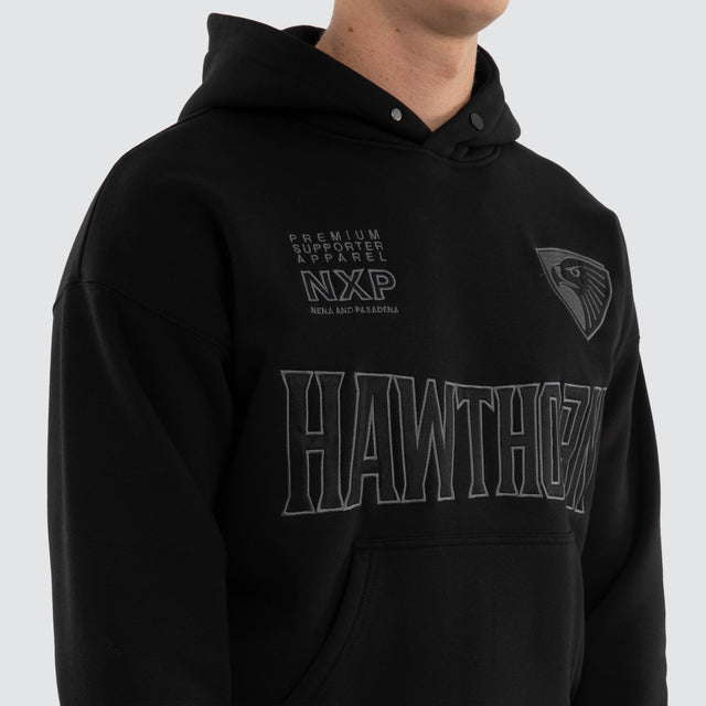 Model wears Hawthorn Hawks AFL Persistent Hoodie Jet Black Hoodies Black – image 5