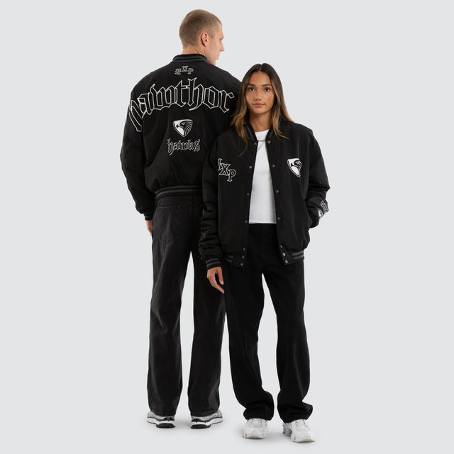 Model wears Hawthorn Hawks AFL Retro Bomber Jet Black Jackets Black – image 3