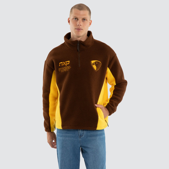 Model wears Hawthorn Hawks AFL Defence Pullover Brown/Yellow Jumpers Brown – image 2