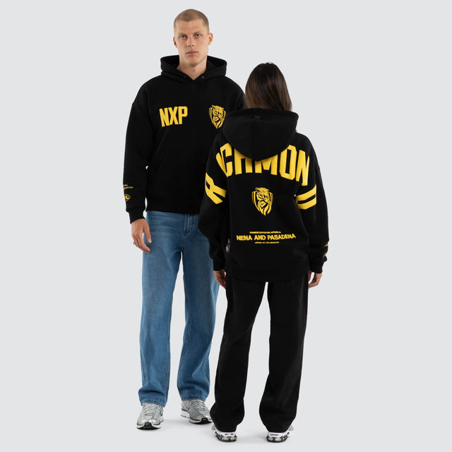 Model wears Richmond Tigers AFL Top Tier Hoodie Jet Black Hoodies Black – image 3