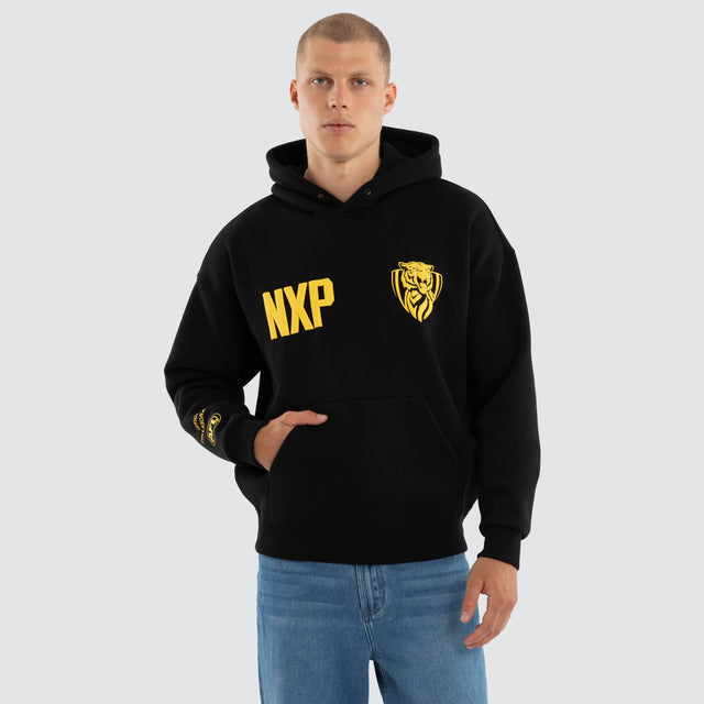 Model wears Richmond Tigers AFL Top Tier Hoodie Jet Black Hoodies Black – image 2