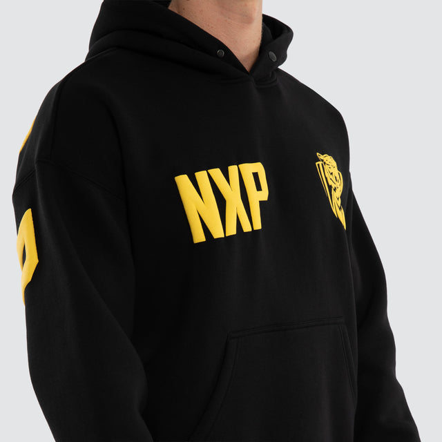 Model wears Richmond Tigers AFL Top Tier Hoodie Jet Black Hoodies Black – image 4