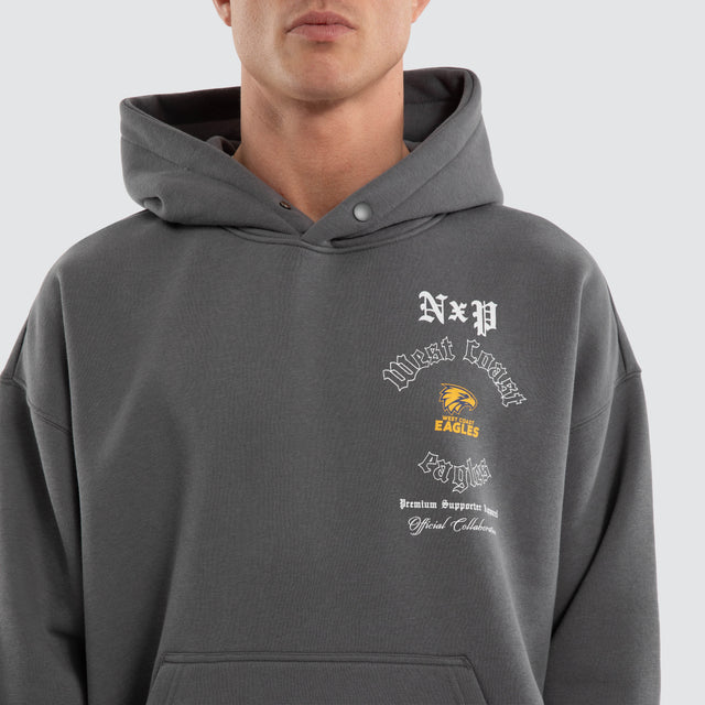 Model wears West Coast Eagles AFL Tag Box Fit Hoodie Charcoal Hoodies Grey – image 5