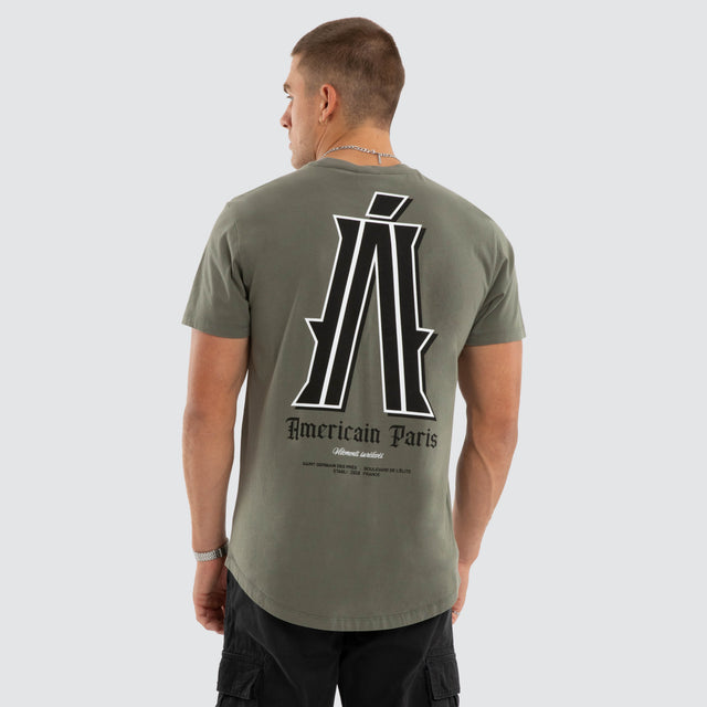 Model wears Pressure Dual Curved Tee Basil T-Shirts Green – image 1