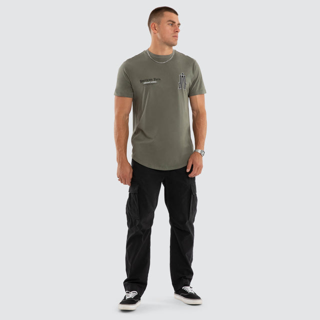 Model wears Pressure Dual Curved Tee Basil T-Shirts Green – image 2