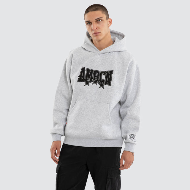 Model wears Tri-Star Relaxed Hoodie Grey Marle Hoodies Grey – image 1