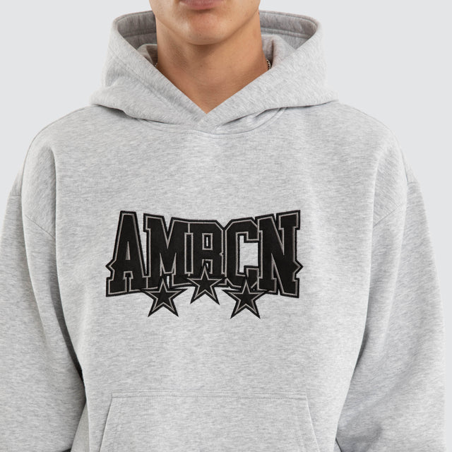 Model wears Tri-Star Relaxed Hoodie Grey Marle Hoodies Grey – image 4